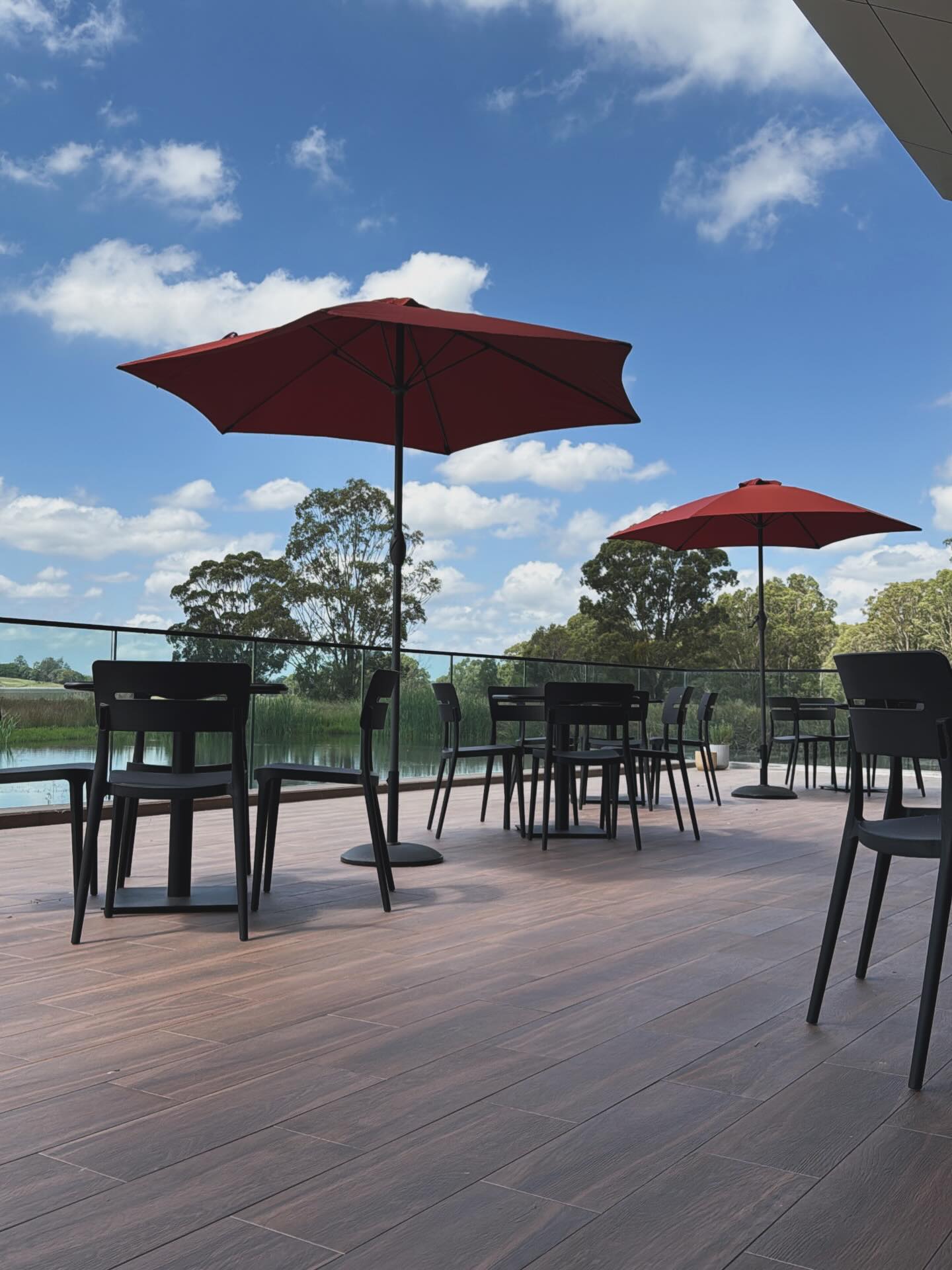 The lakeside terrace with red umbrellas